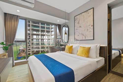 Una cama o camas en una habitación de Orlani by Kozystay - BSD