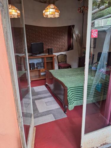 a view of a room with a table and a mirror at Sigloxx in La Pedrera