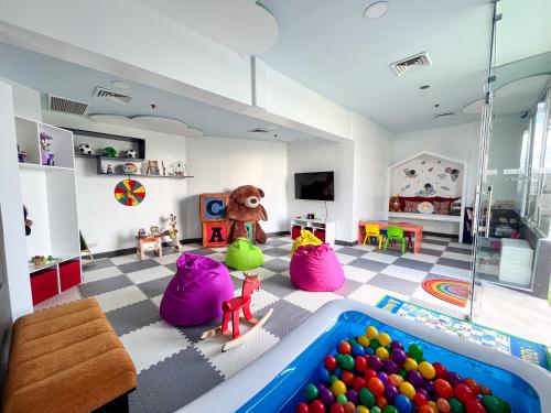 a room with a bunch of toys and a pool at The Bellevue Manila in Manila
