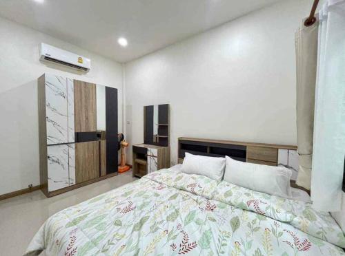 Ένα ή περισσότερα κρεβάτια σε δωμάτιο στο Mali Villa