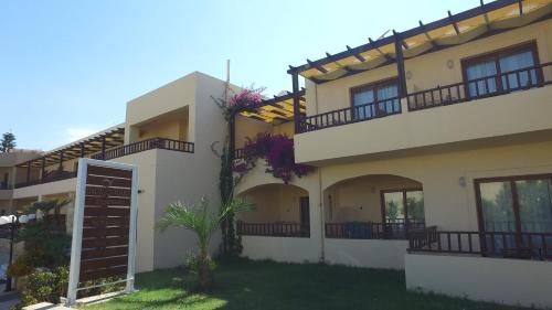 a house with balconies on the side of it at Indigo Mare in Plataniás