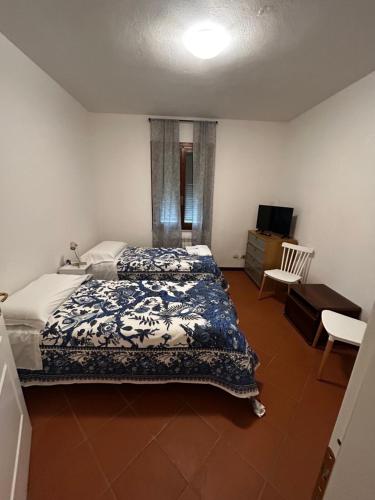 Ένα ή περισσότερα κρεβάτια σε δωμάτιο στο INOsteria CAV Appartamenti