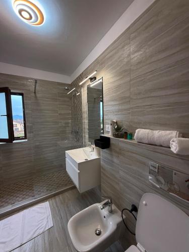 a bathroom with a sink and a toilet and a sink at RelaxMontan Apartment Sanpetru in Sînpetru