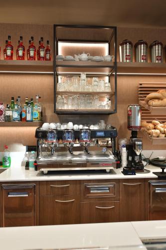 a kitchen with a counter with a stove at Hotel Vignale in Vignale