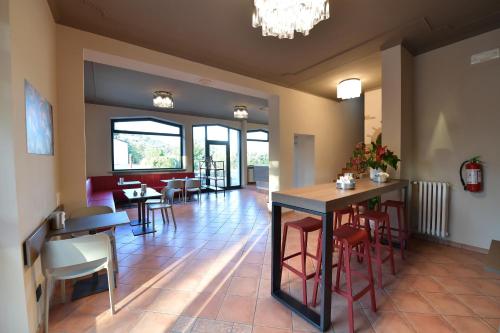 a restaurant with tables and chairs and a dining room at Hotel Vignale in Vignale