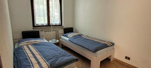 Postel nebo postele na pokoji v ubytování Residenza La Rocca