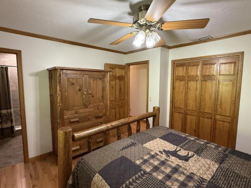 a bedroom with a bed and a ceiling fan at Shuler Farm in Robbinsville