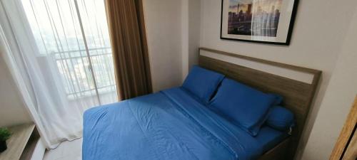 Postel nebo postele na pokoji v ubytování Springwood serene stay Cozy Studio