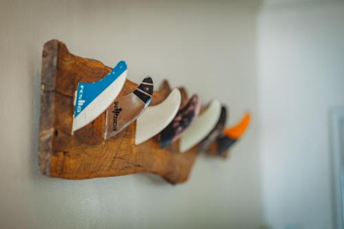 a wooden plate holder hanging on a wall at Silver Spray Beach Accommodation in Victoria Bay