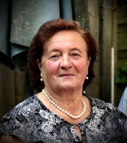 an older woman wearing a necklace and pearl necklace at Apartman Zlata - free parking in Sarajevo