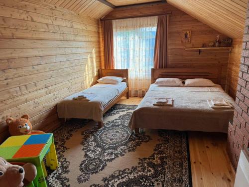 Postel nebo postele na pokoji v ubytování Дача Тиха