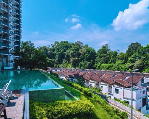 an overhead view of a building with a swimming pool at Majestic Sanctuary Homestay Taiping with Netflix - 2 Carpark in Taiping