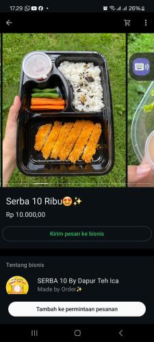 a picture of a tray of food with carrots and rice at Family Guest House in Sumedang Utara