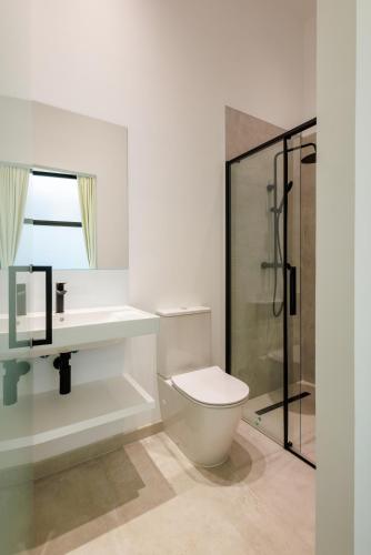 a bathroom with a toilet and a sink and a shower at WE MADRID STUDIOS centro in Madrid