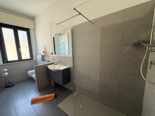 a bathroom with a sink and a shower at Casa Cervi in Gabicce Mare