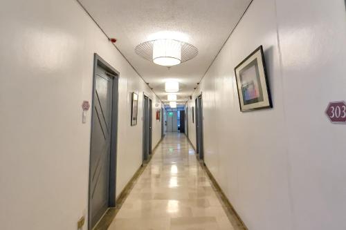 a hallway in a hospital with a hallway at Legazpi Tourist Inn in Legazpi