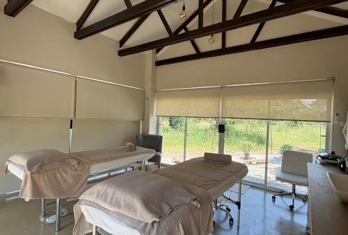a hospital room with two beds and a window at Die Boskamp Self-Catering Bush Retreat in Marble Hall