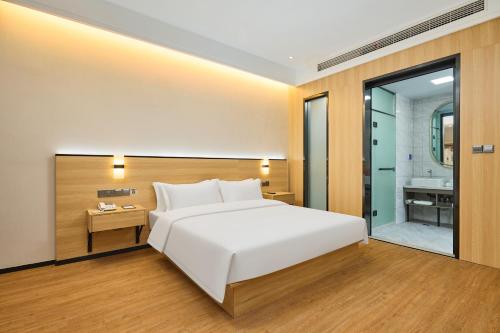Katil atau katil-katil dalam bilik di Urba Hotel, Dongtai Xixi Scenic Area