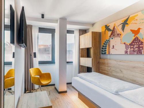 Katil atau katil-katil dalam bilik di B&B HOTEL Albstadt-Hbf
