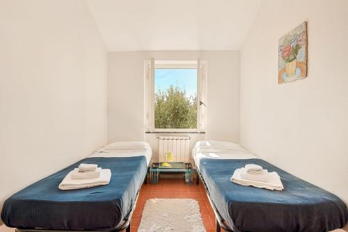 Ένα ή περισσότερα κρεβάτια σε δωμάτιο στο Ladimoradell'artista Sea view Private parking