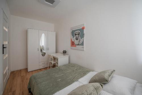 Ένα ή περισσότερα κρεβάτια σε δωμάτιο στο Apartamenty Gliniana