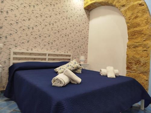 Postel nebo postele na pokoji v ubytování Le Mura Home