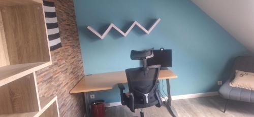 a office with a desk with a coffee maker on it at Villa Lailléa in Laillé