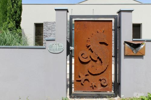 a door with a painting of a horse on the side of a building at Ferienhaus mit Privatpool für 6 Personen ca 130 qm in Kanfanar, Istrien Binnenland von Istrien in Kanfanar