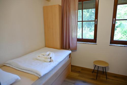 Postel nebo postele na pokoji v ubytování Sobe in apartma Portus