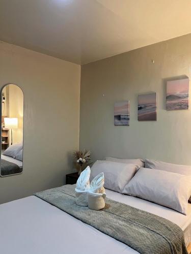 Ένα ή περισσότερα κρεβάτια σε δωμάτιο στο El Nido Lofts - The Apartment