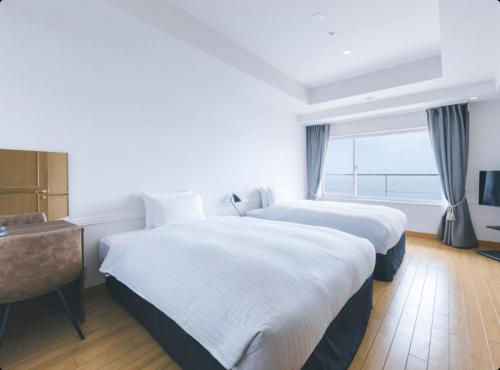 Ένα ή περισσότερα κρεβάτια σε δωμάτιο στο Seaside Hotel Maiko Villa Kobe