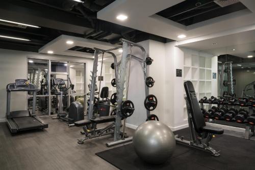 a gym with several tread machines and a ball at Astoria Plaza in Manila