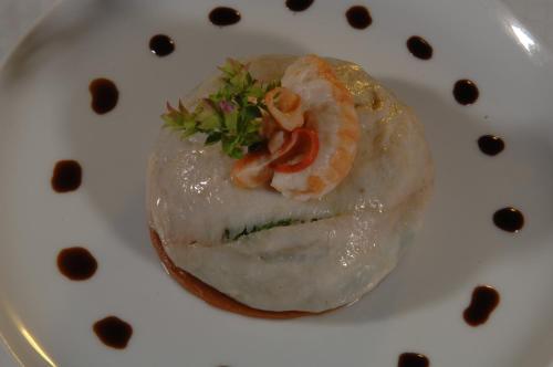 a plate of food with shrimp on top of it at Locanda Chi Ghinn in Verbania