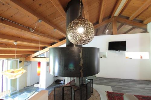 a room with a large metal object in a room at Silea Apartments, Pool, Garden, Treviso in Silea