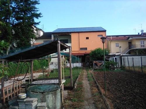 a house with a playground in front of a yard at B&B 'Tra i due Parchi'' in Avezzano