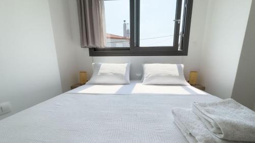 Ένα ή περισσότερα κρεβάτια σε δωμάτιο στο Nikiti Aqua Mare Suites