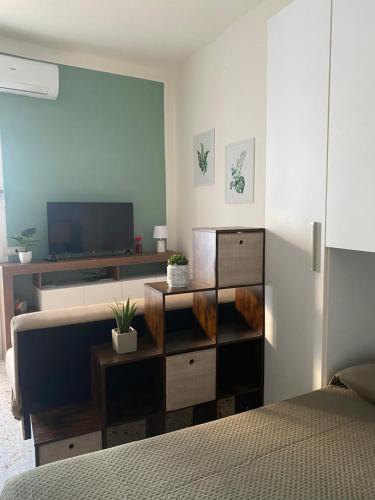 Ένα ή περισσότερα κρεβάτια σε δωμάτιο στο Essential Apartments