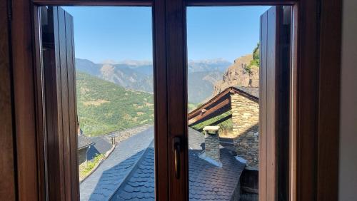 a window with a view of a mountain view at Apartament Rural Burg in Burg