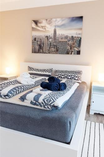 a bedroom with a bed with a blue stuffed animal on it at Ferienhaus Kitzenwiese in Friedrichshafen