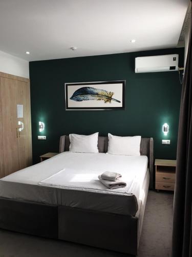 Ένα ή περισσότερα κρεβάτια σε δωμάτιο στο Jayhun Hotel Urgench