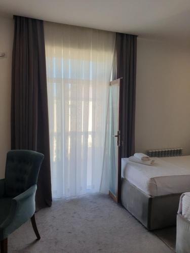 Ένα ή περισσότερα κρεβάτια σε δωμάτιο στο Jayhun Hotel Urgench