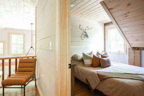 a bedroom with a bed in a house at Lux Chalet 4 Bd Fireplace HotTub AC Pet Friendly in Killington
