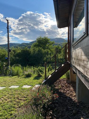 a stairway to a house with a view of the mountains at Bungalouri Olanesti in Băile Olăneşti