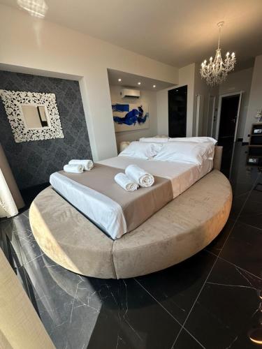 Una cama o camas en una habitación de Vista Templi Luxury Suite