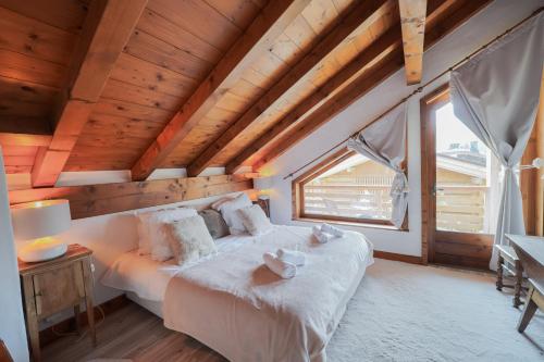 Postel nebo postele na pokoji v ubytování Chalet Merveille - Proche centre ville de Megève