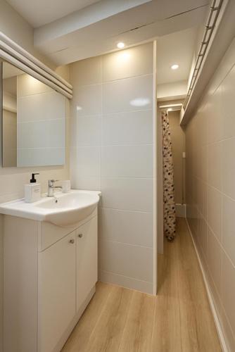 a bathroom with a sink and a mirror at Studio palais des festivals Croisette in Cannes