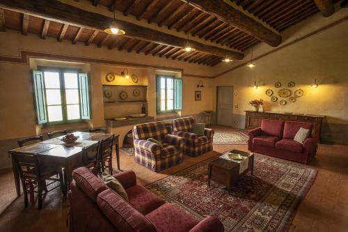 a large living room with couches and a table at Cortona Resort-Le Terre Dei Cavalieri in Cortona