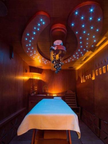 a bedroom with a bed and a ceiling with lights at La Villa vacation home Lake Como in Como