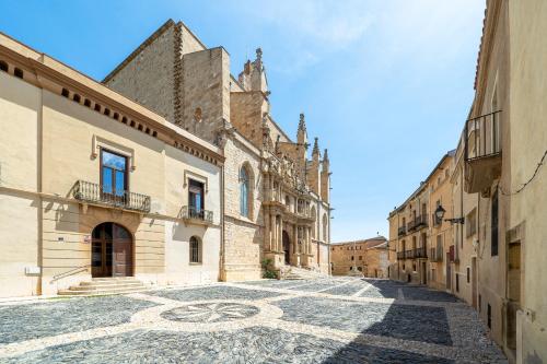 an empty street with a mosaic floor in a building at Hauzify I Apartaments La Plaça in Montblanc