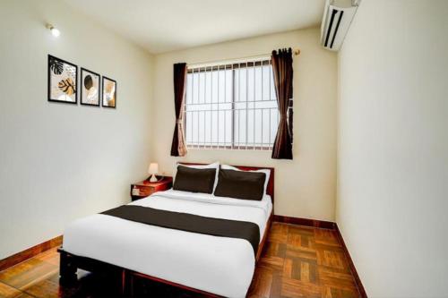 Ένα ή περισσότερα κρεβάτια σε δωμάτιο στο Applepie Residency